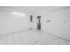 Unfinished basement with white tile flooring and walls, ready for customization at 8054 38Th N Ave, St Petersburg, FL 33710