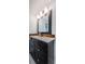 A bathroom vanity with a dark wood frame, a white countertop, and modern fixtures at 8054 38Th N Ave, St Petersburg, FL 33710