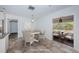 Dining room with tile floors, a dining table, and staged with decorative items, creating a inviting atmosphere at 8054 38Th N Ave, St Petersburg, FL 33710
