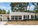 Charming single-story home featuring black shutters and large windows for plenty of natural light at 8054 38Th N Ave, St Petersburg, FL 33710