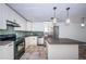 Updated kitchen with stainless steel appliances, subway tile backsplash, and granite countertops at 8054 38Th N Ave, St Petersburg, FL 33710