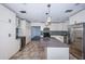 Renovated kitchen with a kitchen island, stainless appliances, mosaic back splash, and granite countertops at 8054 38Th N Ave, St Petersburg, FL 33710