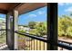 Scenic balcony view of the calm waterfront and lush landscaping surrounding the home at 9118 Brunswick Ln, Tampa, FL 33615