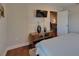 A cozy bedroom featuring a TV, decor, and doorway to living area at 9118 Brunswick Ln, Tampa, FL 33615