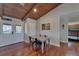 Cozy dining area near the kitchen, featuring wood floors and a view of the hallway at 9118 Brunswick Ln, Tampa, FL 33615
