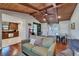 Inviting living room featuring hardwood floors, an arcade game, and a cozy atmosphere at 9118 Brunswick Ln, Tampa, FL 33615