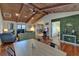 Open-concept living room with vaulted ceilings, hardwood floors, and unique design at 9118 Brunswick Ln, Tampa, FL 33615