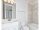 Cozy bathroom features a single sink, vanity, framed mirror, and bathtub with tiled shower at 9951 Trellis Vine Way, Parrish, FL 34219