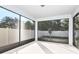 A sunroom with large screened windows overlooking the backyard at 9951 Trellis Vine Way, Parrish, FL 34219