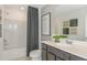 Bathroom featuring a shower-tub combo and modern vanity at 9959 Trellis Vine Way, Parrish, FL 34219