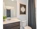 Well-lit bathroom with modern fixtures and decorative artwork at 9959 Trellis Vine Way, Parrish, FL 34219