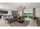 Spacious living room with modern furnishings, open floor plan, and scenic views at 9959 Trellis Vine Way, Parrish, FL 34219