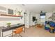 Comfortable living room area with desk, couch and a ceiling fan at 9959 Trellis Vine Way, Parrish, FL 34219