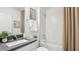 Clean bathroom features a shower and tub combination with a modern vanity and neutral decor at 1004 Spotted Egret Loop, Ruskin, FL 33570