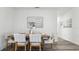 Inviting dining area with rustic wood table and seating for four, creating a cozy atmosphere at 1004 Spotted Egret Loop, Ruskin, FL 33570