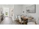 Stylishly decorated dining room featuring a wooden table and seating for six guests at 1004 Spotted Egret Loop, Ruskin, FL 33570