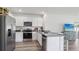 Modern kitchen featuring stainless steel appliances, solid countertops and ample cabinet space at 1004 Spotted Egret Loop, Ruskin, FL 33570