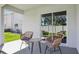 Covered lanai with outdoor seating, offering a relaxing space to enjoy the view at 1004 Spotted Egret Loop, Ruskin, FL 33570