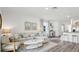 Open-concept living area blending comfort and style with easy flow to the kitchen and dining spaces at 1004 Spotted Egret Loop, Ruskin, FL 33570
