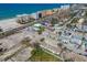 An aerial view of a beach-side community, highlighting its close proximity to the beach at 101 146Th Ave, Madeira Beach, FL 33708