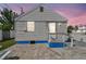 Cozy backyard featuring a small patio, ideal for relaxing outdoors in a private setting at 101 146Th Ave, Madeira Beach, FL 33708