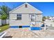 Cozy backyard featuring a small patio, ideal for relaxing outdoors in a private setting at 101 146Th Ave, Madeira Beach, FL 33708