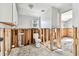 Bathroom featuring a toilet and exposed framing, awaiting personalization and renovation at 101 146Th Ave, Madeira Beach, FL 33708