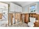 Bathroom area equipped with a toilet, complemented by natural light from a window at 101 146Th Ave, Madeira Beach, FL 33708