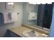 Well-lit bathroom featuring a clean white sink, matching faucet, and a mirror above at 101 146Th Ave, Madeira Beach, FL 33708