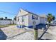Inviting home with a well-maintained exterior, complemented by ample parking space and landscaping at 101 146Th Ave, Madeira Beach, FL 33708