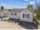 Charming home showcasing a classic design and blue accents, in a sunny neighborhood setting at 101 146Th Ave, Madeira Beach, FL 33708