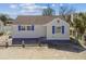 Charming cottage with blue trim and a concrete parking area; ideal for a cozy getaway at 101 146Th Ave, Madeira Beach, FL 33708