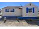 Classic home exterior with well-maintained siding and complementary blue window shutters at 101 146Th Ave, Madeira Beach, FL 33708