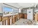 Partially renovated kitchen showing modern cabinets with exposed studs and a beach house view at 101 146Th Ave, Madeira Beach, FL 33708
