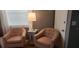 Cozy sitting area with matching chairs, a small table with drawers and a lamp providing gentle light at 101 146Th Ave, Madeira Beach, FL 33708