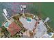 Waterfront property featuring a large triangular lot, boat dock, and swimming pool at 11050 7Th E St, Treasure Island, FL 33706