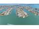 Stunning aerial view of waterfront homes and canals on a beautiful sunny day at 11050 7Th E St, Treasure Island, FL 33706