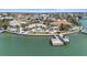 Waterfront home featuring a pool and boat dock on a picturesque canal, perfect for the boating enthusiast at 11050 7Th E St, Treasure Island, FL 33706