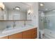 Bathroom features double vanity and walk in shower at 11050 7Th E St, Treasure Island, FL 33706