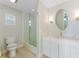 Bathroom with white cabinets, walk-in shower, and new fixtures at 11050 7Th E St, Treasure Island, FL 33706