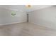 Bright bedroom featuring modern floors and decorative chandelier lighting at 11050 7Th E St, Treasure Island, FL 33706