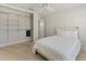 Bedroom with a closet with custom shelving system and neutral wall color at 11050 7Th E St, Treasure Island, FL 33706