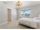 Bedroom featuring gorgeous water views and a ceiling fan with decorative light fixture at 11050 7Th E St, Treasure Island, FL 33706