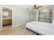 Bedroom with light floors, ceiling fan and closet plus sink area view at 11050 7Th E St, Treasure Island, FL 33706
