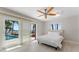 Inviting bedroom with a view of the water and access to the outdoor pool area at 11050 7Th E St, Treasure Island, FL 33706