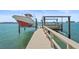Boat lift and dock provide easy access to the water for boating enthusiasts at 11050 7Th E St, Treasure Island, FL 33706