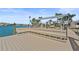 Dock featuring built-in seating offers a relaxing space to enjoy waterfront views at 11050 7Th E St, Treasure Island, FL 33706
