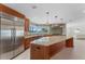 Modern kitchen featuring custom cabinets, stainless steel appliances, and a center island at 11050 7Th E St, Treasure Island, FL 33706