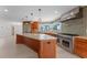 Gourmet kitchen with stainless steel appliances, large island, and picturesque water views at 11050 7Th E St, Treasure Island, FL 33706