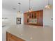 Modern kitchen with quartz countertops, custom wood cabinetry, and pendant lighting at 11050 7Th E St, Treasure Island, FL 33706